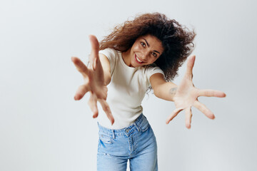 Come To Me. Excited Latin Lady Extending Hands At Camera, Holding Big Invisible Object, Curly Woman...
