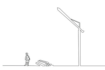 a worker and pieces of iron at the construction site