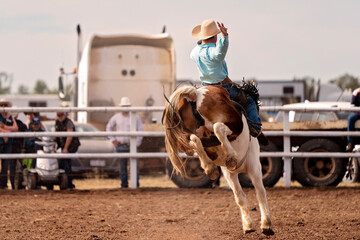 Saddle Bronco Riding At Country Rodeo