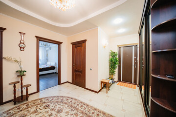 entrance hall with a large mirrored wardrobe and shoe cabinet. 