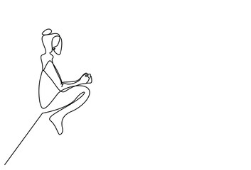 a young healthy woman sitting outside in nature calmly stands and drinks coffee tea