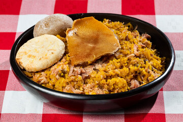 Typical tolimense lechona with rice - Typical Colombian dish