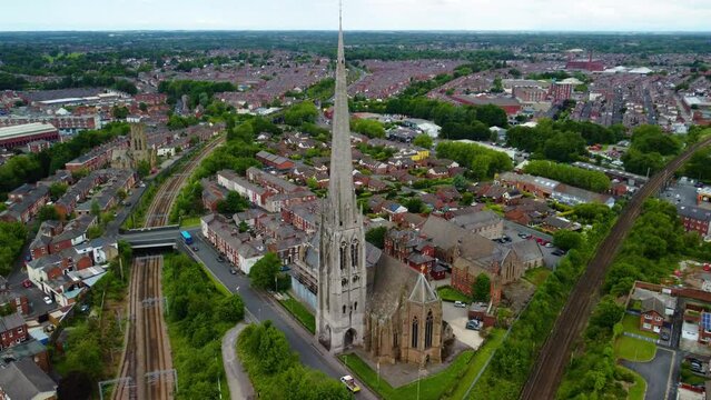Aerial falling clip of the Spire of the Shrine Church of St. Walburge's Preston Lancashire England