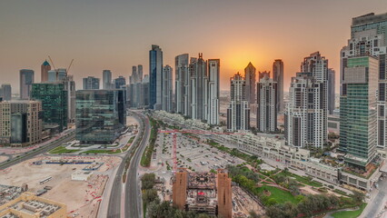 Bay Avenue during sunset with modern towers in Business Bay aerial panoramic timelapse, Dubai