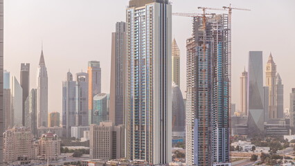 Row of the tall buildings around Sheikh Zayed Road and DIFC district aerial timelapse in Dubai