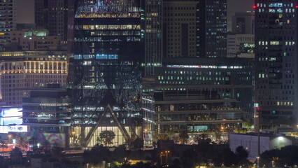 Modern buildings around Sheikh Zayed Road and DIFC district aerial night timelapse in Dubai