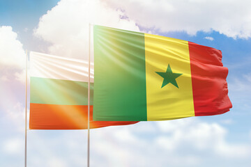 Sunny blue sky and flags of senegal and bulgaria