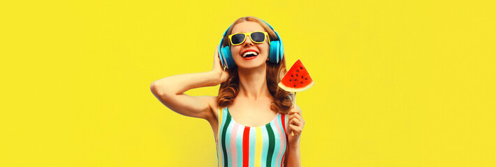 Summer colorful portrait of cheerful happy laughing young woman in headphones listening to music...
