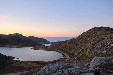 Lake in Teriberka in autumn. Colorful tundra landscape on the Kola Peninsula in autumn