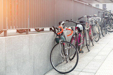 Closeup view many city bikes parked in row at european city street rental parking sharing station...