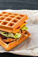 Belgian waffles with chicken fillet and cucumber. Belgian food