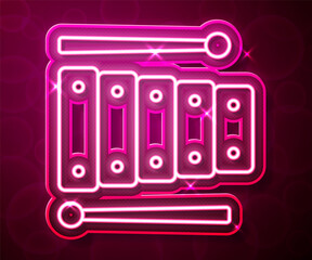 Obraz premium Glowing neon line Xylophone - musical instrument with thirteen wooden bars and two percussion mallets icon isolated on red background. Vector