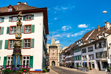 Spalen gate and fountain in the old town of Basel, Switzerland - obrazy, fototapety, plakaty