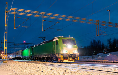 Fototapeta na wymiar Freight train at Abisko in Swedish Lapland in winter