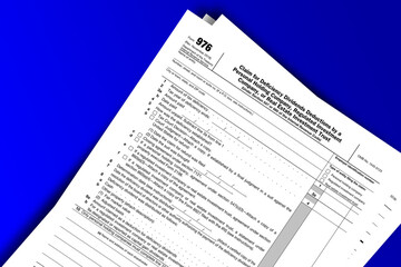 Form 976 documentation published IRS USA 11.13.2018. American tax document on colored