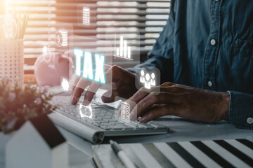 Tax concept for business, Businessman using computer to complete Individual income tax return form...