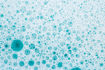  white foam bubbles.Cleanliness and hygiene background. Foam Water Soap Suds.Texture Foam Close-up....