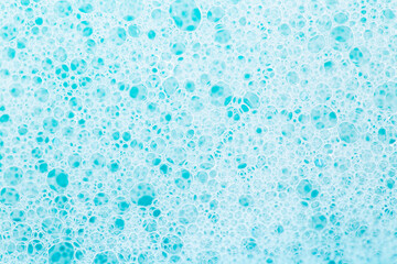 white foam bubbles.Cleanliness and hygiene background. Foam Water Soap Suds.Texture Foam Close-up. blue soap bubbles background.Laundry and cleaning background.foam bubbles.