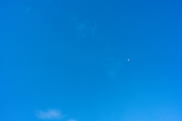 Fototapeta na wymiar blue sky with crescent and clouds