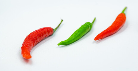 red and green chili on white background, pepper, paprika

