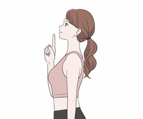 指を差す横を向いたスポーツインストラクター