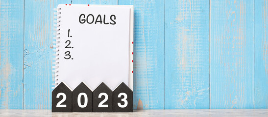 2023 Happy New Year with GOAL word and wooden number. time for a New Start, Resolution, Plan, Action and Mission Concept