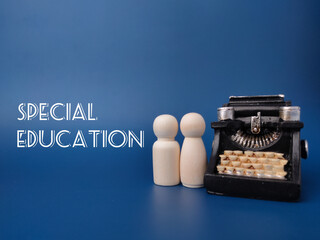 Wooden figures and vintage typewritter with the word SPECIAL EDUCATION.