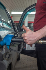 Refueling a car with excellent fuel at a gas station