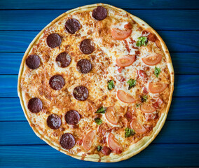 food cooking, culinary and people concept - cook or baker hand with pizza on peel at pizzeria