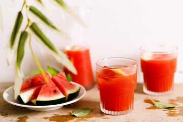 Fresh watermelon juice with ice in a glass.