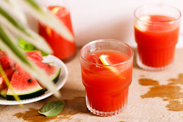 Fresh watermelon juice with ice in a glass.