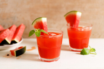 Fresh watermelon juice with ice in a glass.