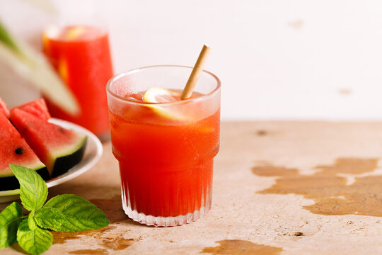 Fresh watermelon juice with ice in a glass.