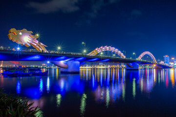 Dragon bridge - a famous location for tourists much attractive at night time of the weekend with fire and water spitting - Da Nang city, Vietnam.