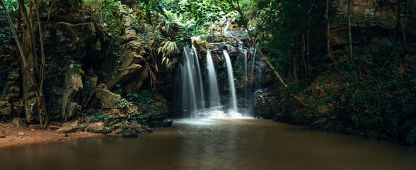Fototapeta na wymiar Waterfall in the tropical forest in the rainy season