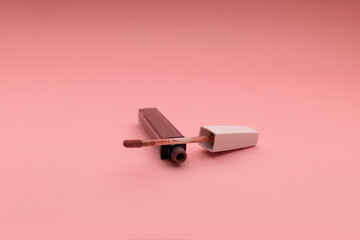 Lipstick on a pink background, object shot