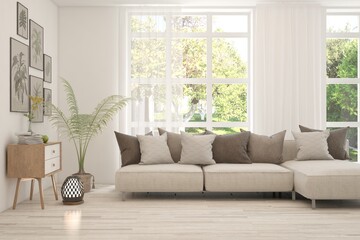 White living room with sofa and summer landscape in window. Scandinavian interior design. 3D illustration