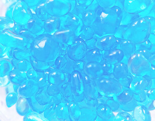 青い雫型のガラスフレークのテクスチャ背景