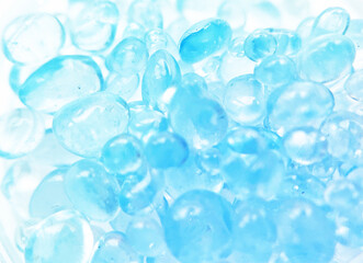 薄いブルーの雫型ガラスフレークのテクスチャ背景