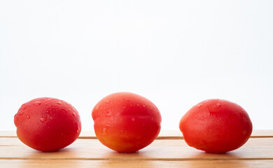 fresh tomato on wood background
