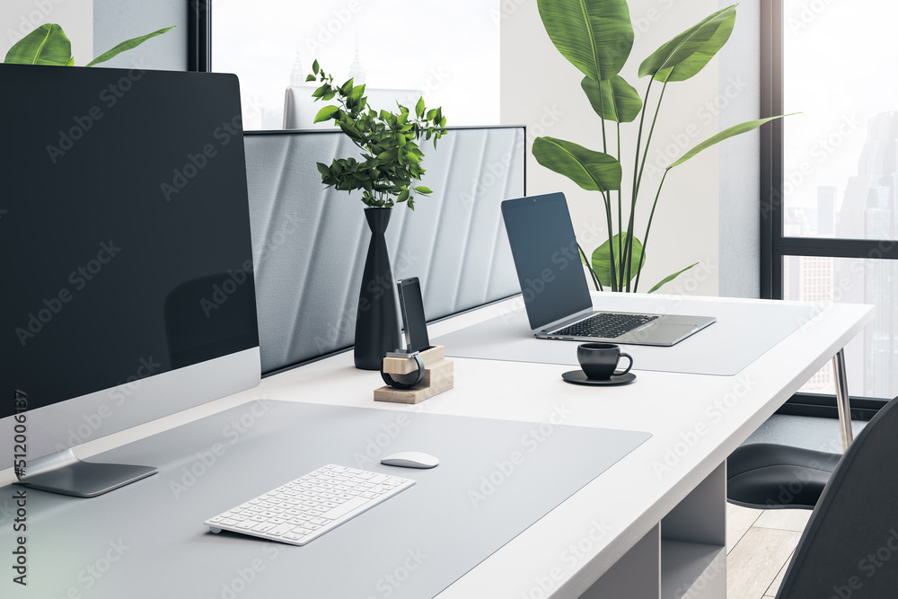 Poster Close up and side view of creative white designer workplace with mock up computer screen, partition, coffee cup, decorative plant and supplies. Window with city view in the background. 3D Rendering.