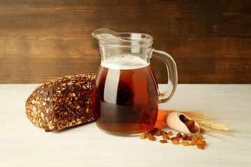 Concept of fresh drink on white wooden table, kvass