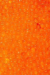 Red caviar as an abstract background.