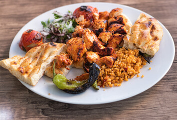 Chicken Kebab Chicken Servingon White Plate on Table Filled with Spicy Spices