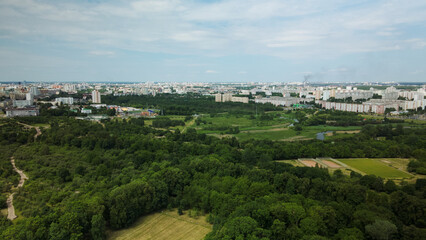 Flight over the city park. You can see park buildings. Aerial photography.