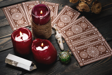 Tarot cards on the old wooden table of fortune teller concept. Top view.