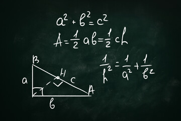 Basic triangle area formulas and Pythagorean theorem written on chalkboard - Powered by Adobe