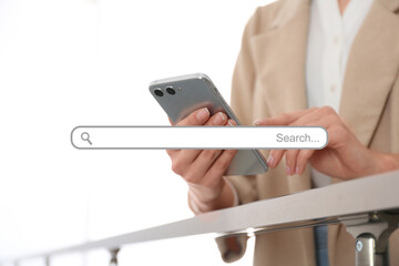 Search bar of website and woman using modern smartphone indoors, closeup