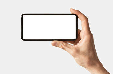 Hand holding smartphone with white mockup screen isolated on white background for web site design, logo, app - clipping path