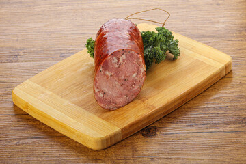 Pork ham sausage over board
